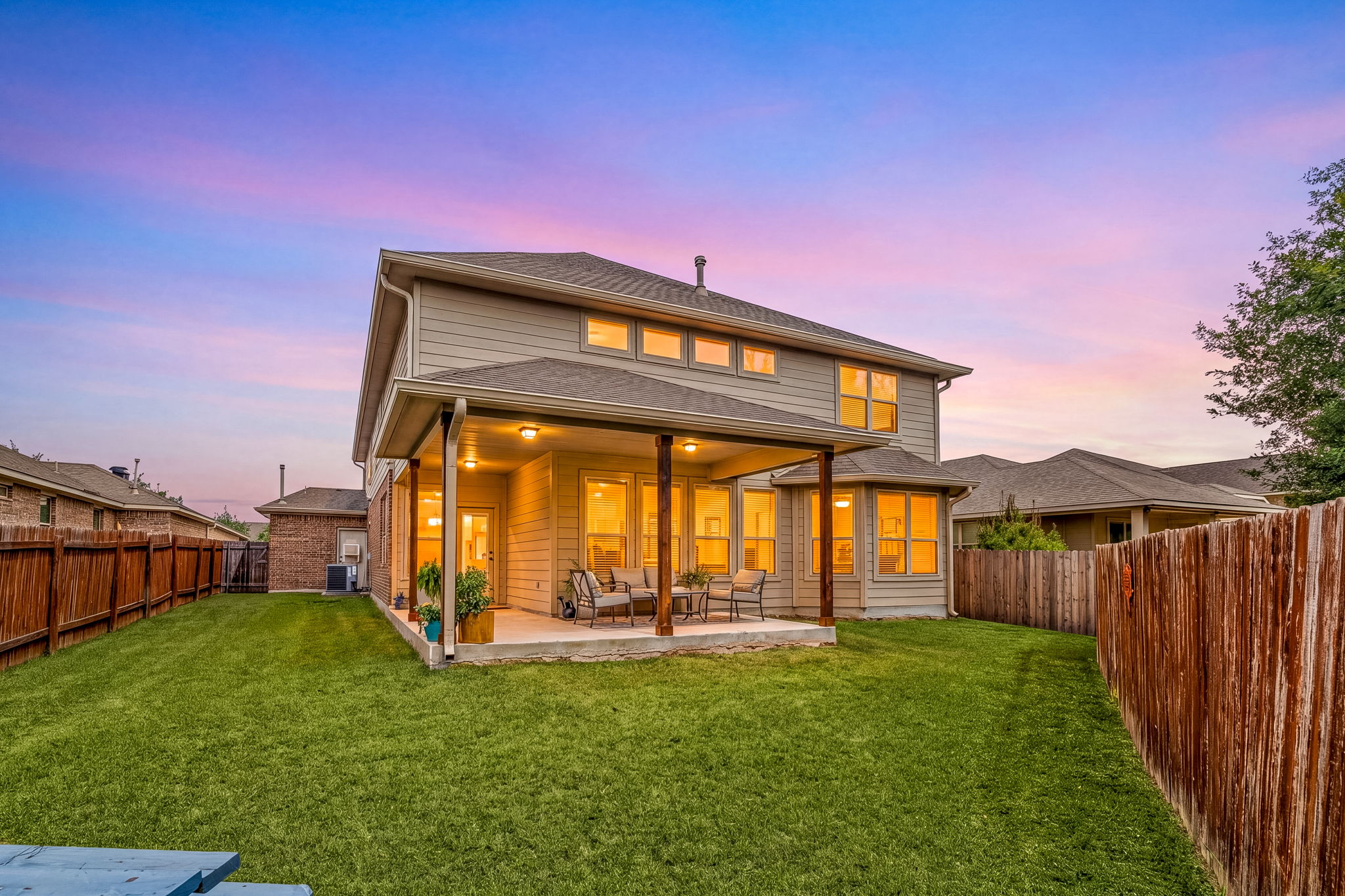 225 Pettigrew Path Buda, TX 78610 - Photo 33 of 38 a front view of a house with a yard