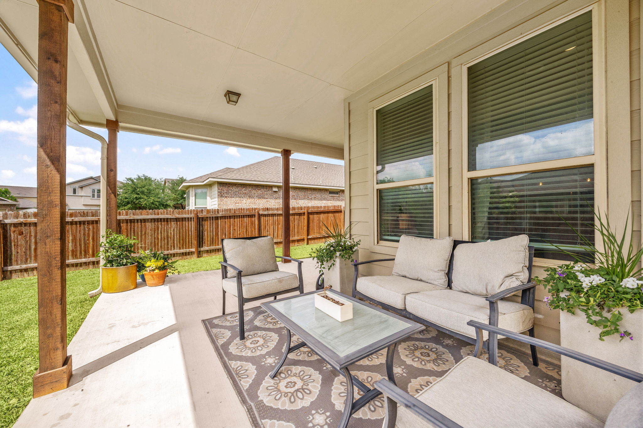 225 Pettigrew Path Buda, TX 78610 - Photo 34 of 38 a living room with furniture and a large window