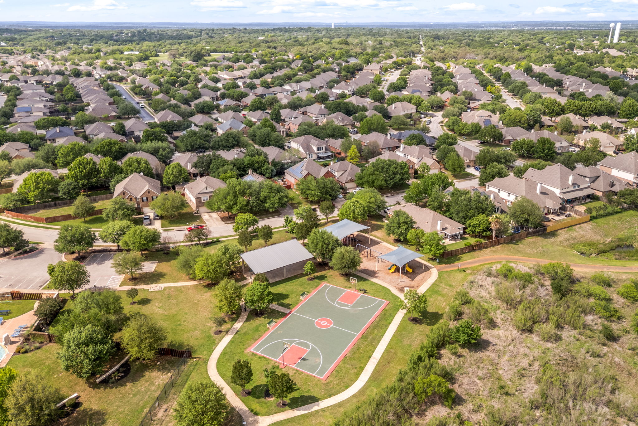 225 Pettigrew Path Buda, TX 78610 - Photo 37 of 38 an aerial view of residential houses with yard
