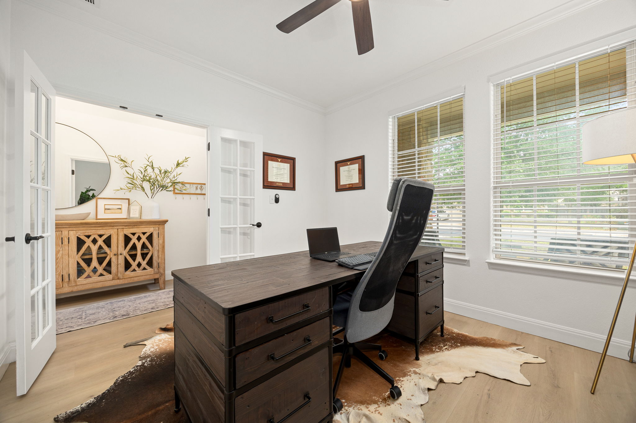 225 Pettigrew Path Buda, TX 78610 - Photo 4 of 38 a living room with furniture and a window