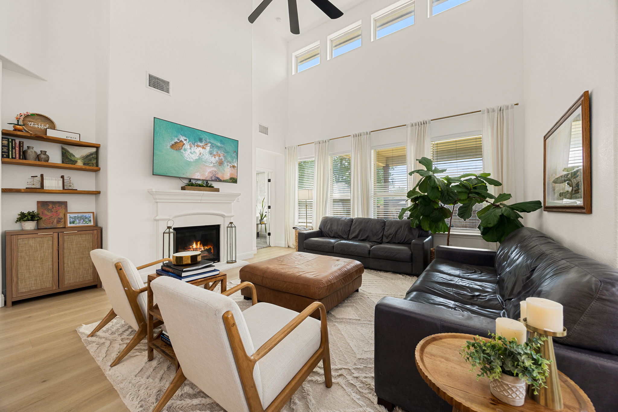 225 Pettigrew Path Buda, TX 78610 - Photo 6 of 38 a living room with furniture and a fireplace