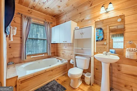 a bathroom with a bathtub and shower