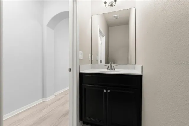 a bathroom with a sink and a mirror
