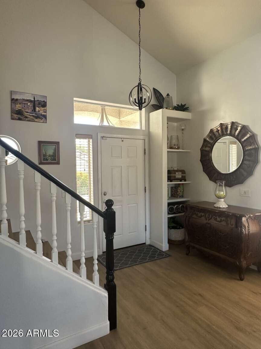 2576 East Brooks Street Gilbert, AZ 85296 - Photo 9 of 18 a view of a hallway with furniture and windows