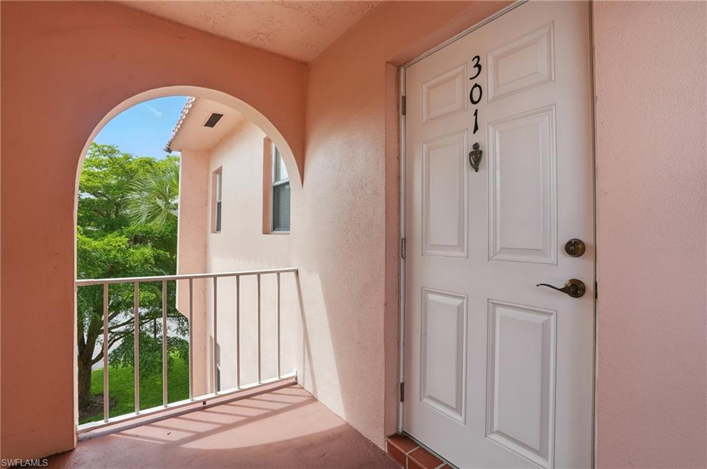 170 Turtle Lake Court, Unit 301 Naples, FL 34105 - Photo 21 of 23 a view of staircase with white walls and a window