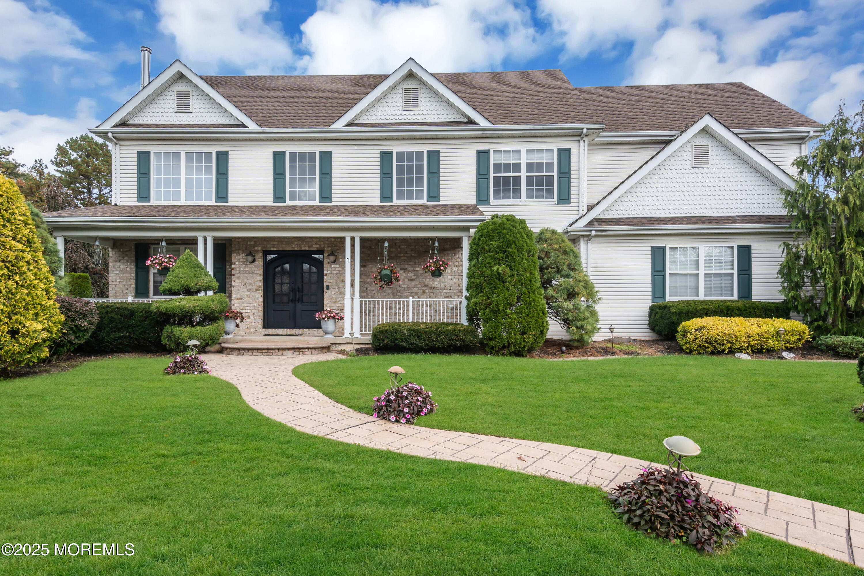 front view of a house with a yard