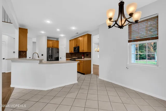a view of kitchen with furniture and window