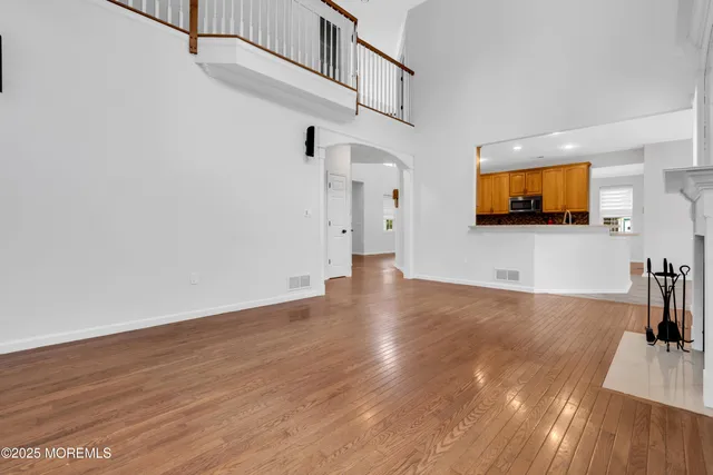 a view of livingroom with hardwood floor and workspace