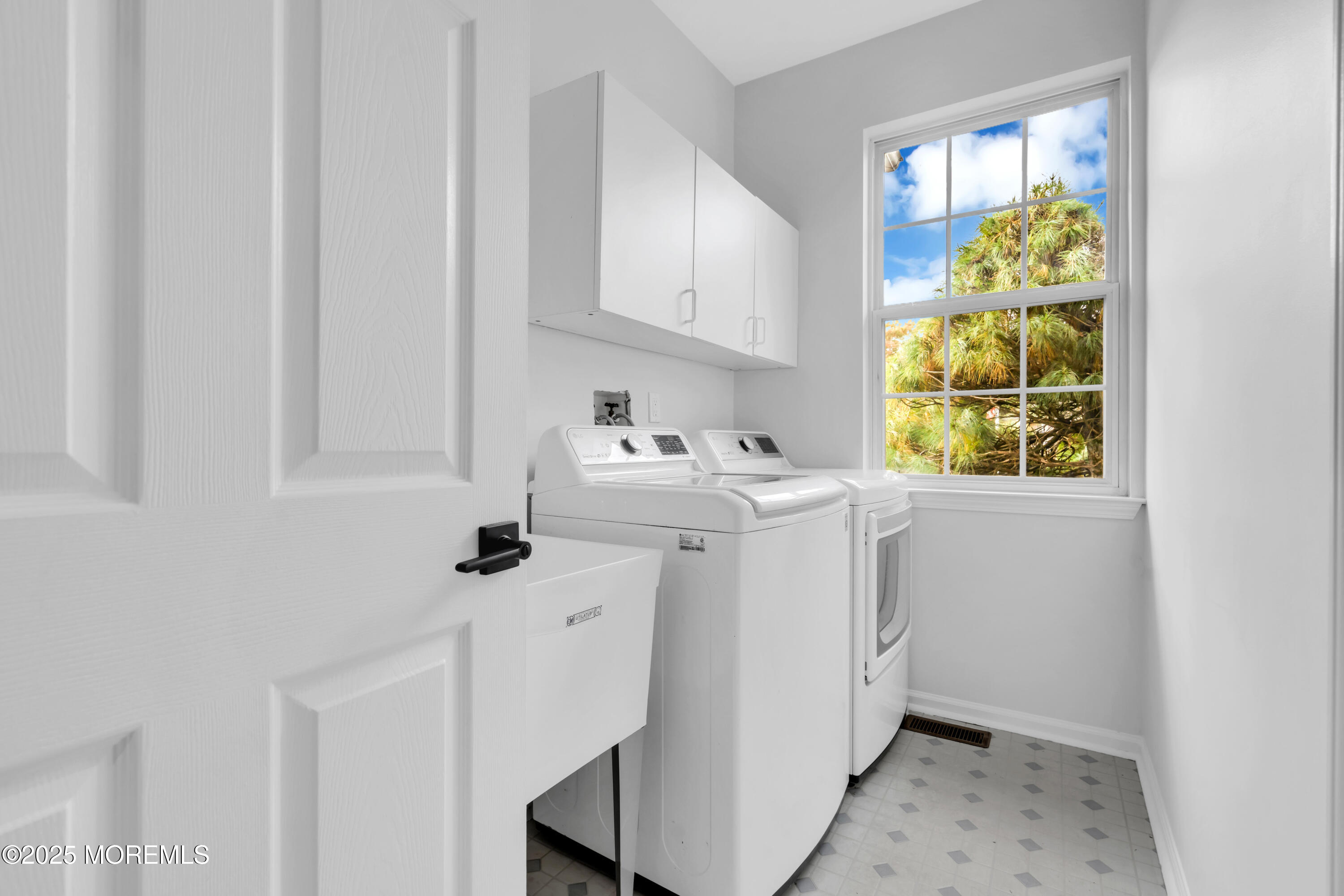 3 Wellesly Court Jackson, NJ 08527 - Photo 17 of 35 a utility room with cabinets washer and dryer