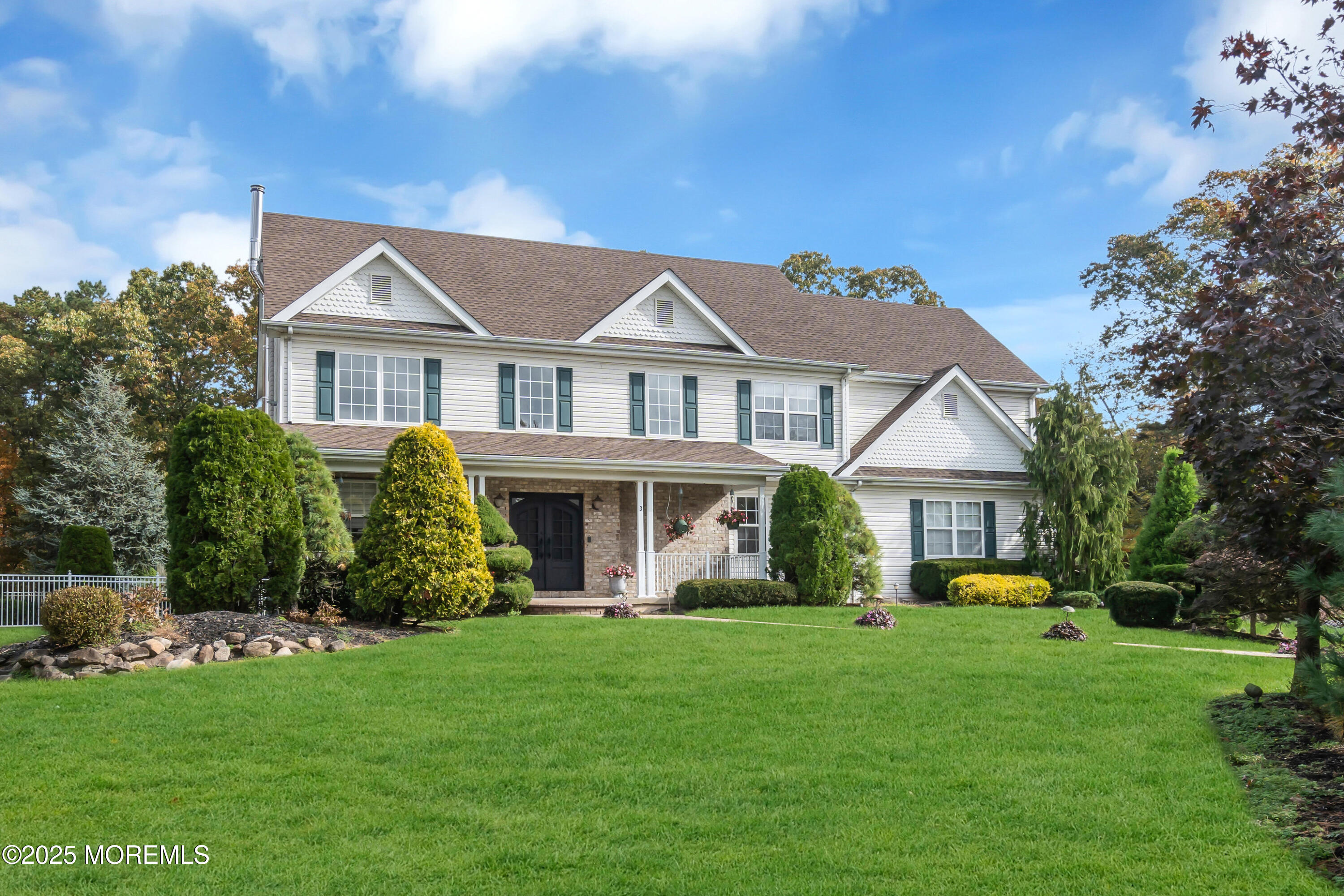 3 Wellesly Court Jackson, NJ 08527 - Photo 2 of 35 a front view of a house with a garden and trees