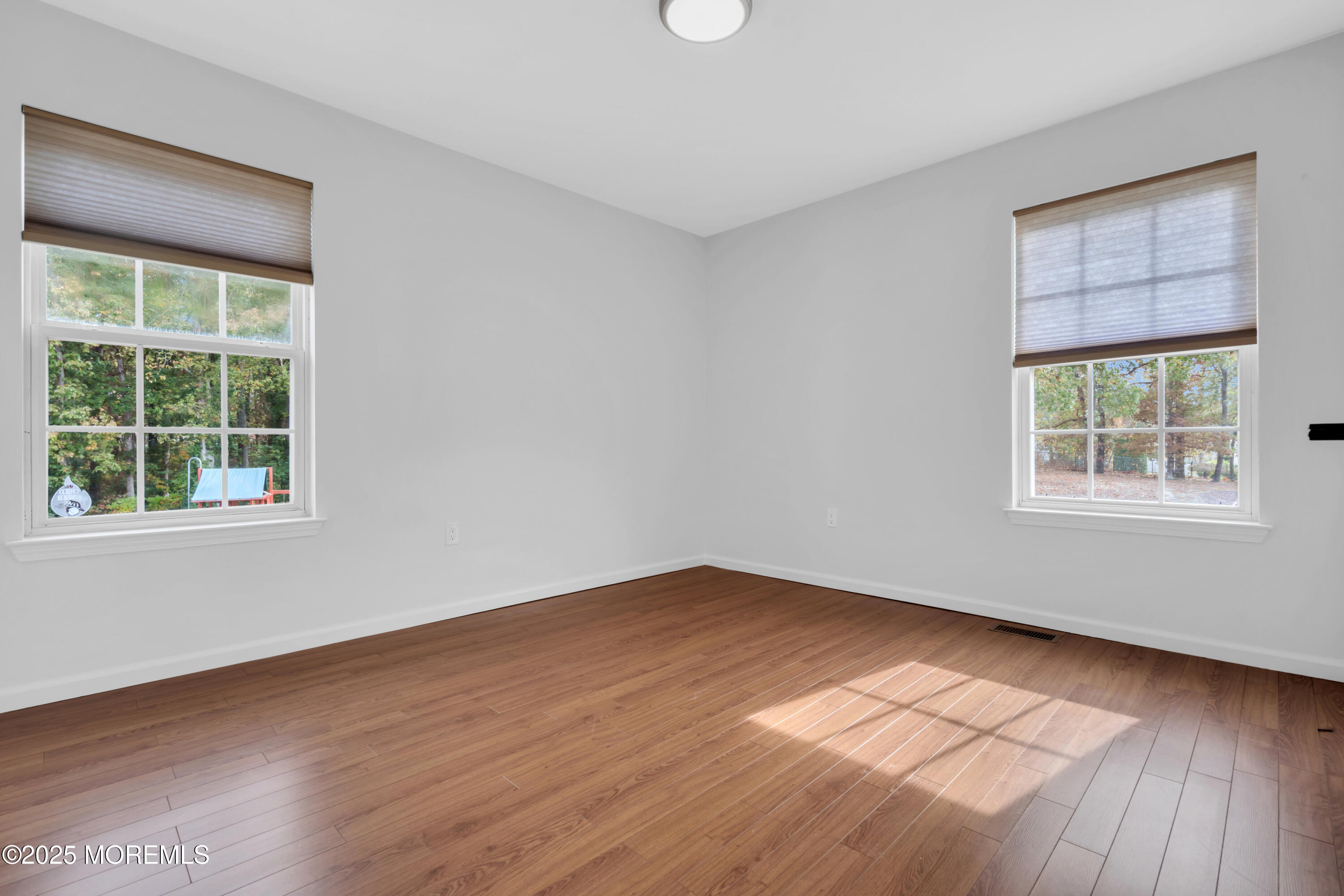 3 Wellesly Court Jackson, NJ 08527 - Photo 26 of 35 an empty room with wooden floor and windows