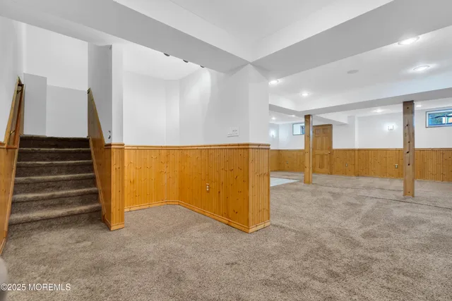 a view of an empty room with stairs