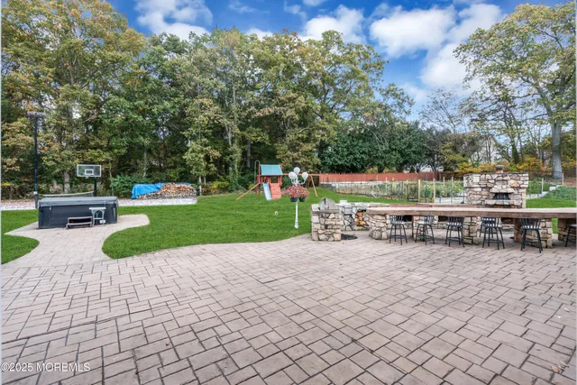 a view of a house with backyard porch and sitting area