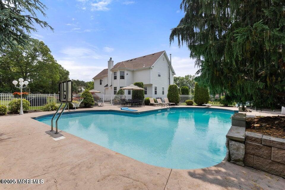 3 Wellesly Court Jackson, NJ 08527 - Photo 4 of 35 a swimming pool with outdoor seating and yard