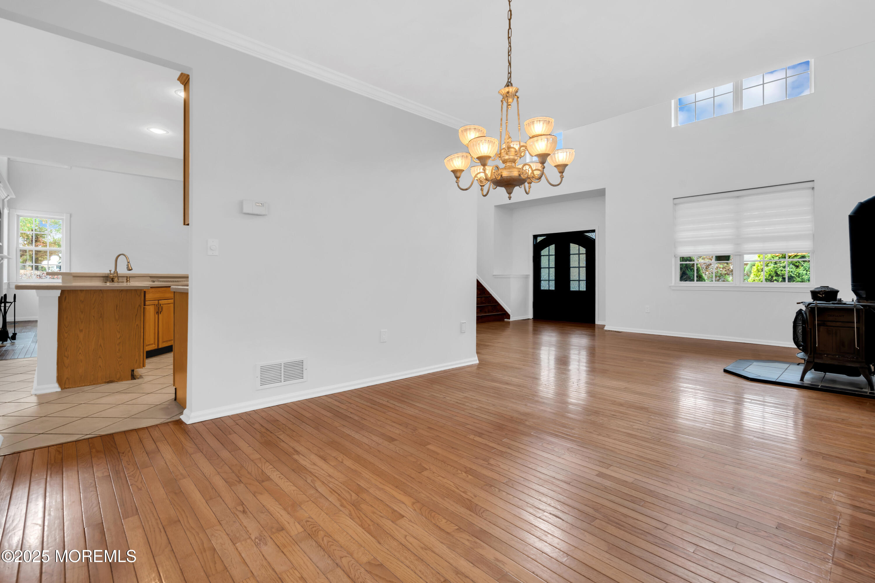 3 Wellesly Court Jackson, NJ 08527 - Photo 9 of 35 a view of a room with wooden floor and kitchen space