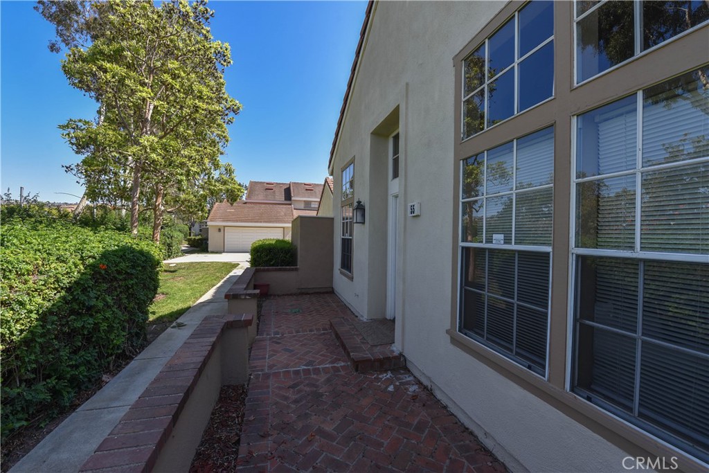 55 Wellesley, Unit 55 Irvine, CA 92612 - Photo 11 of 11 a view of a pathway of a house with a yard