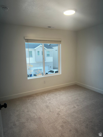 61 South Lunar Way Mapleton, UT 84664 - Photo 13 of 15 Spare room featuring carpet floors and a smoke detector