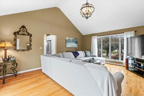 a bed room with a bed and a chair