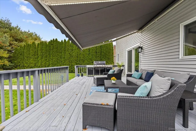 a balcony with furniture and a garden
