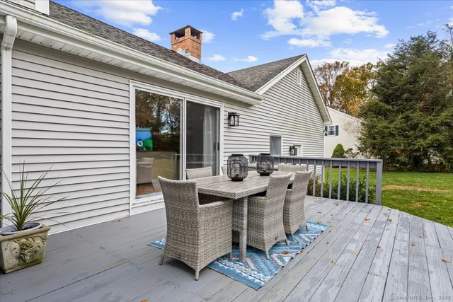 a view of a patio with a table and chairs