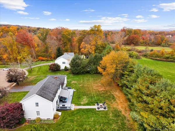 an aerial view of a house with a yard