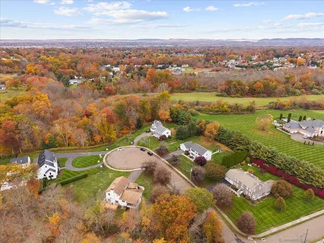 an aerial view of a residential houses with outdoor space