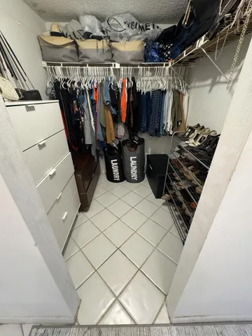 a kitchen with a stove and a shower