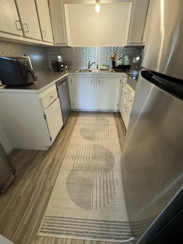 a living room with furniture and a rug