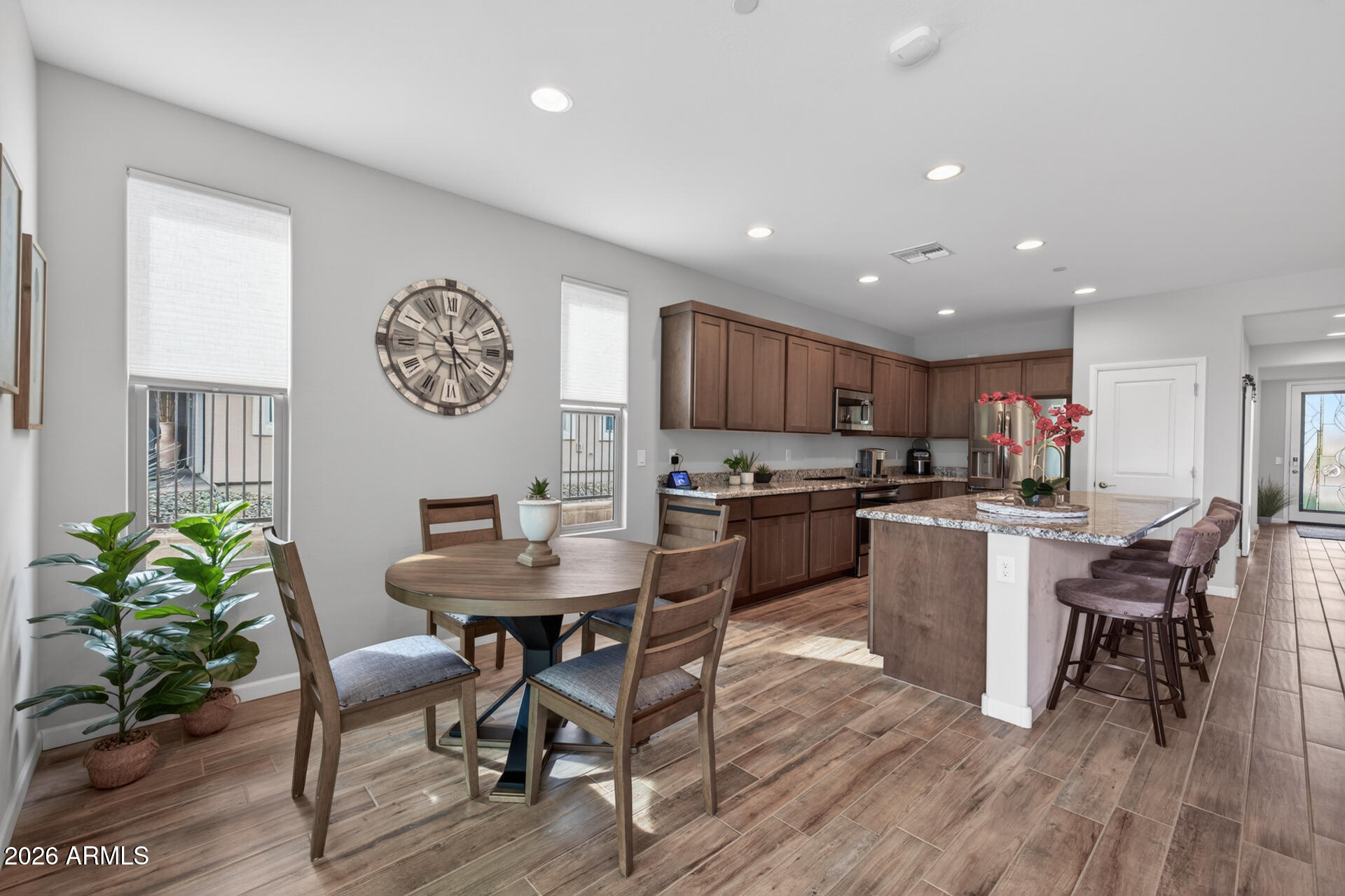 17443 East Cindercone Road Rio Verde, AZ 85263 - Photo 14 of 70 a kitchen with a table and chairs in it