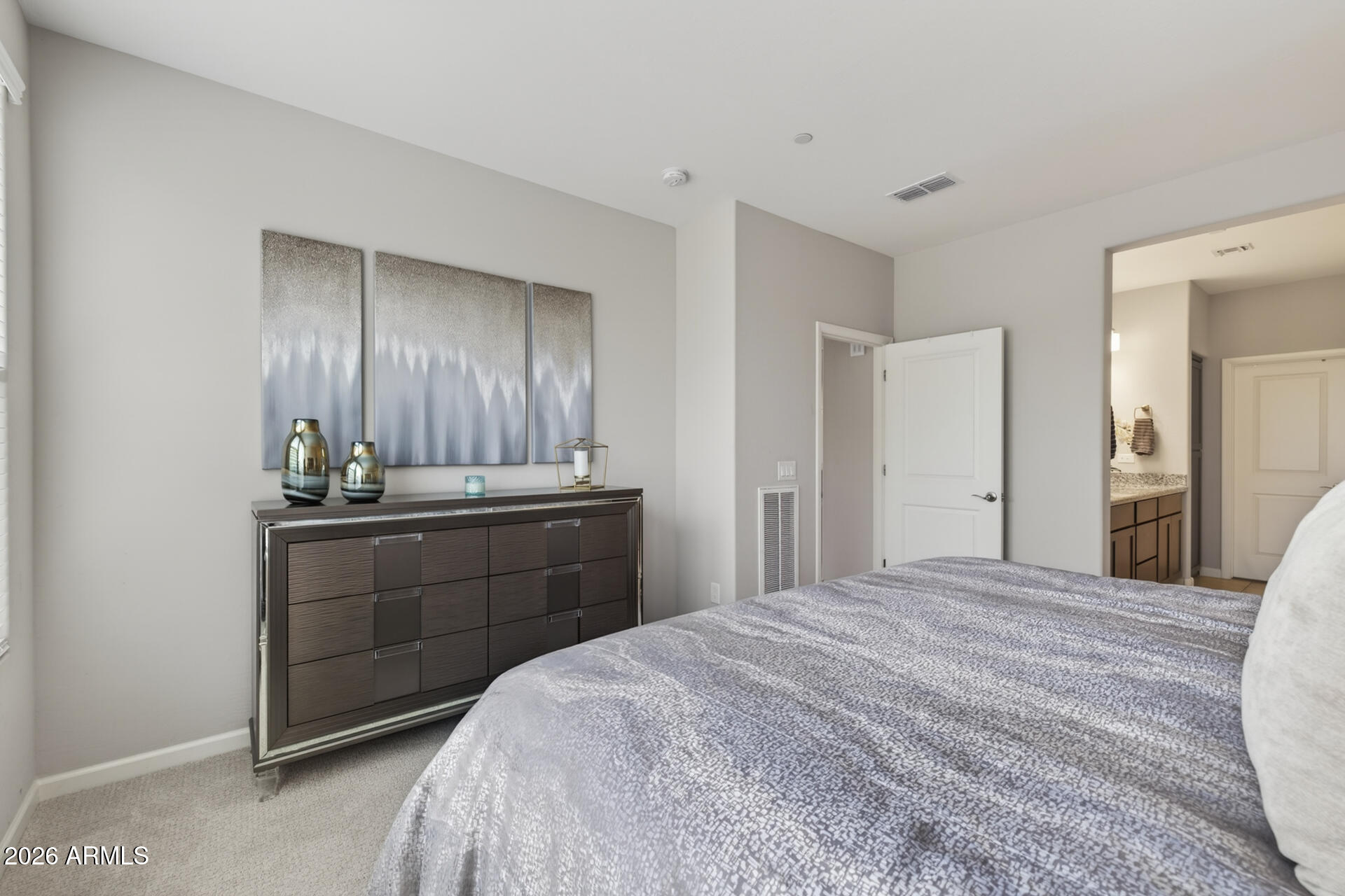 17443 East Cindercone Road Rio Verde, AZ 85263 - Photo 17 of 70 a bedroom with a bed and cabinets