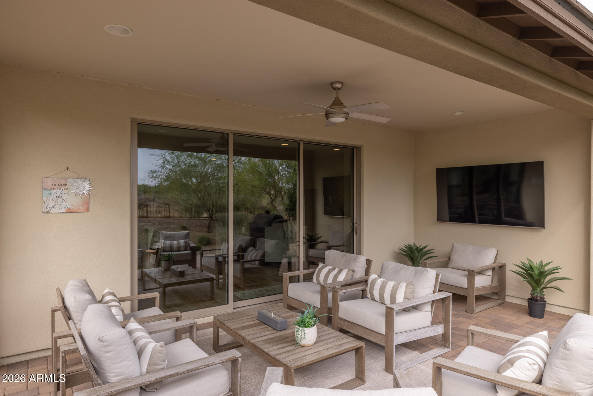 17443 East Cindercone Road Rio Verde, AZ 85263 - Photo 40 of 70 a living room with furniture and a flat screen tv