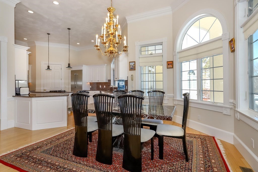 12 Cherokee Road Canton, MA 02021 - Photo 13 of 39 a view of a a dining room with furniture window and wooden floor