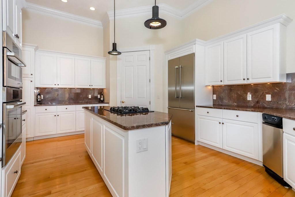 12 Cherokee Road Canton, MA 02021 - Photo 14 of 39 a kitchen with granite countertop a sink stainless steel appliances and cabinets