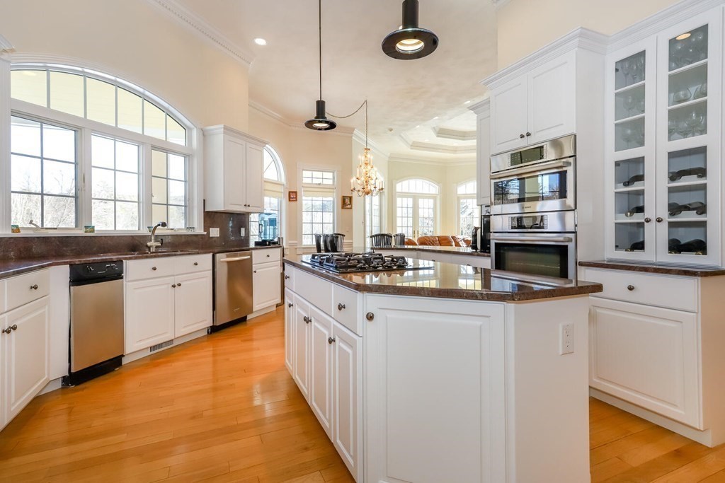 12 Cherokee Road Canton, MA 02021 - Photo 15 of 39 a large kitchen with stainless steel appliances lots of counter space and a sink