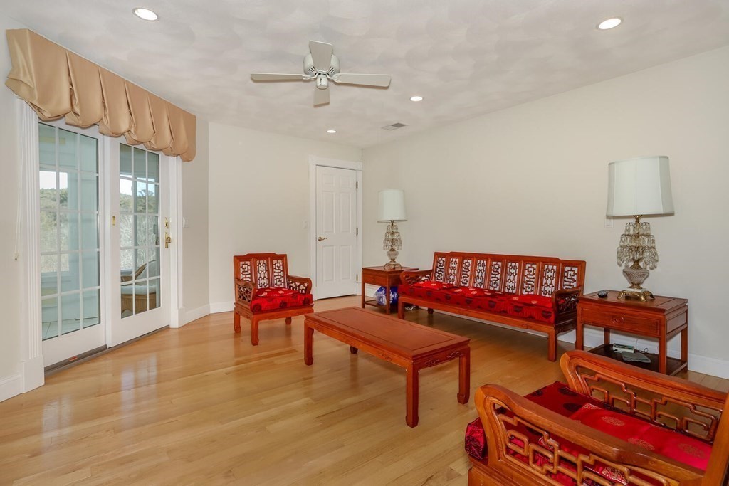 12 Cherokee Road Canton, MA 02021 - Photo 29 of 39 a living room with furniture and a chandelier