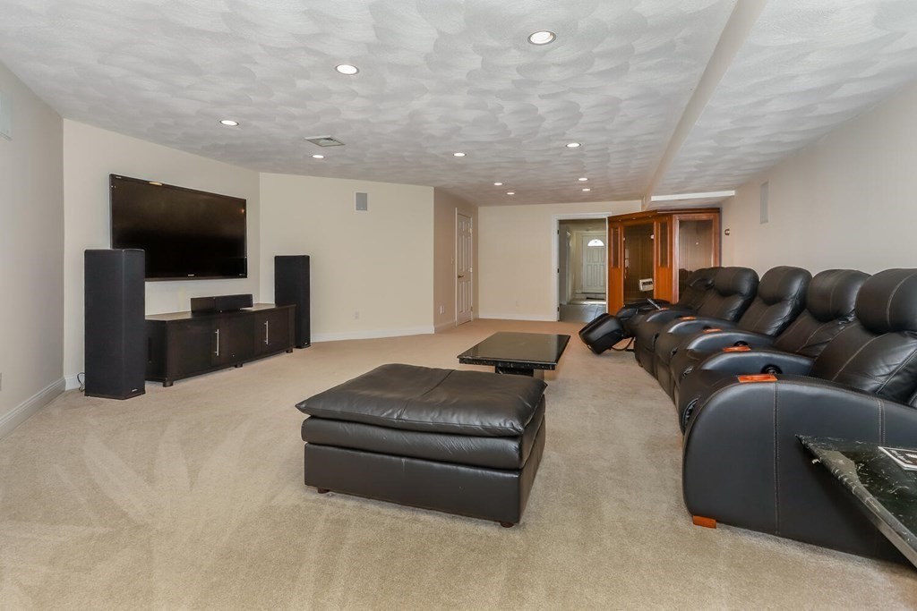 12 Cherokee Road Canton, MA 02021 - Photo 33 of 39 a living room with furniture and a flat screen tv