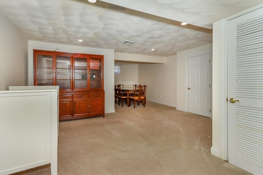 12 Cherokee Road Canton, MA 02021 - Photo 36 of 39 a view of a livingroom with furniture and an empty room