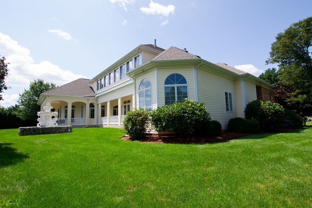 12 Cherokee Road Canton, MA 02021 - Photo 4 of 39 a front view of a house with a garden