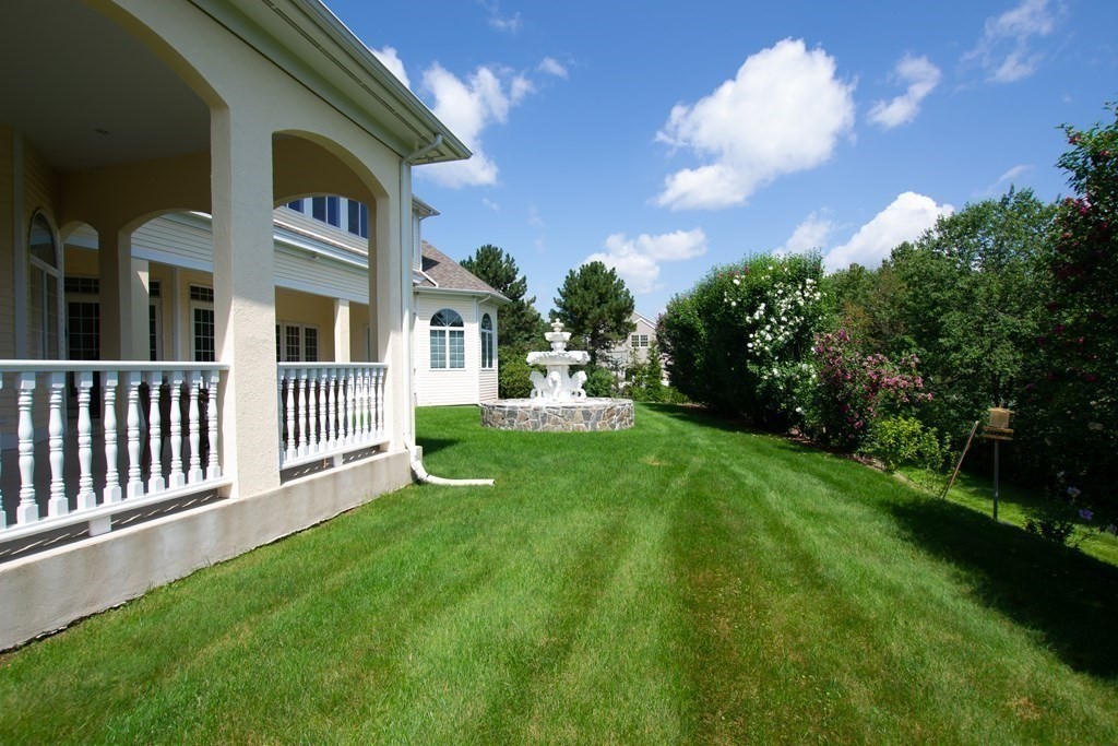 12 Cherokee Road Canton, MA 02021 - Photo 7 of 39 a view of a house with a yard and a garden