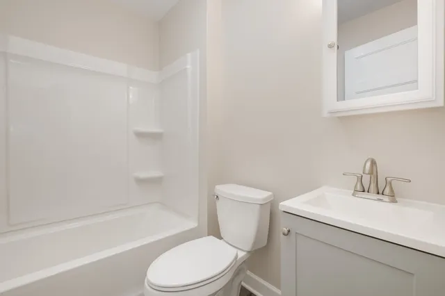 a bathroom with a sink toilet and bathtub