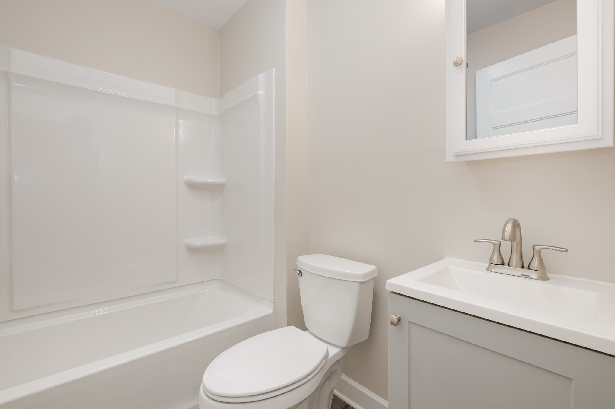 417 West Coffee Street Tullahoma, TN 37388 - Photo 14 of 34 a bathroom with a sink toilet and bathtub