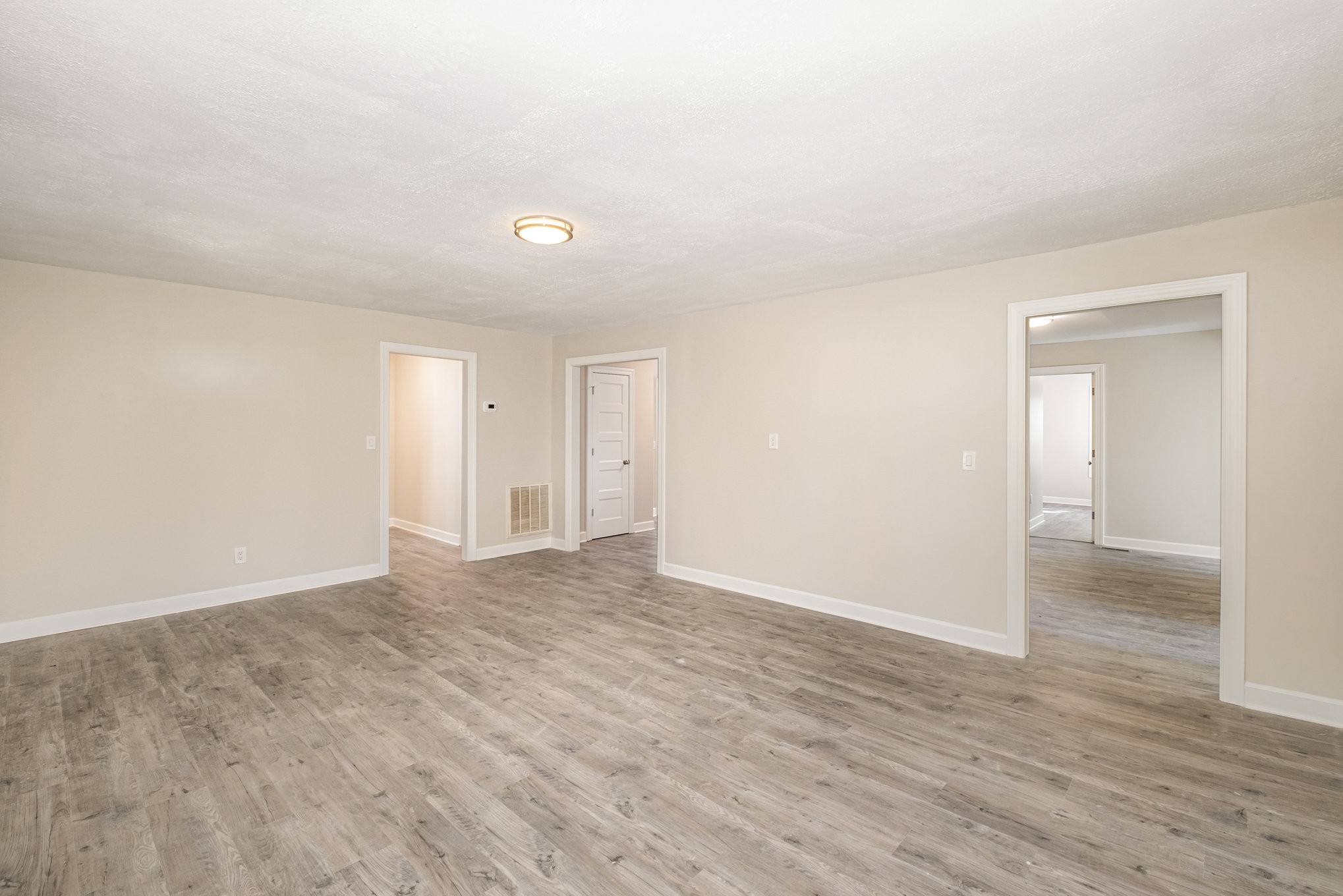 417 West Coffee Street Tullahoma, TN 37388 - Photo 22 of 34 a view of an empty room and wooden floor