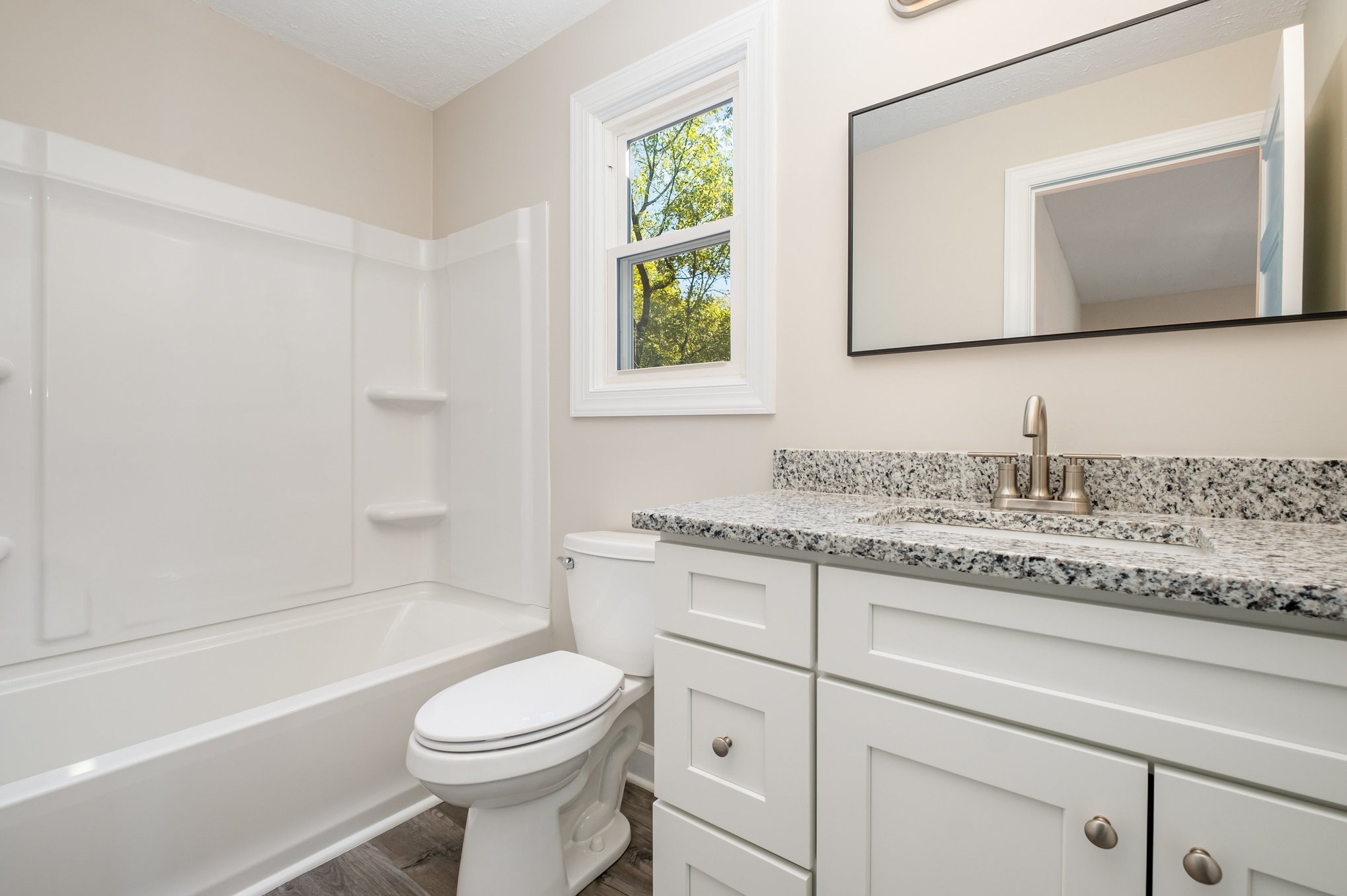 417 West Coffee Street Tullahoma, TN 37388 - Photo 24 of 34 a bathroom with a granite countertop toilet sink and mirror