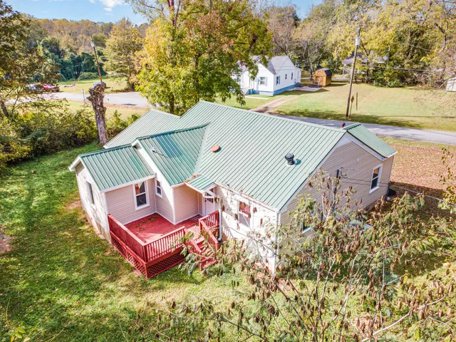 a view of a chairs and table in the backyard