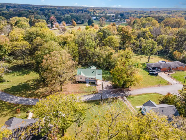 an aerial view of residential houses with swimming pool