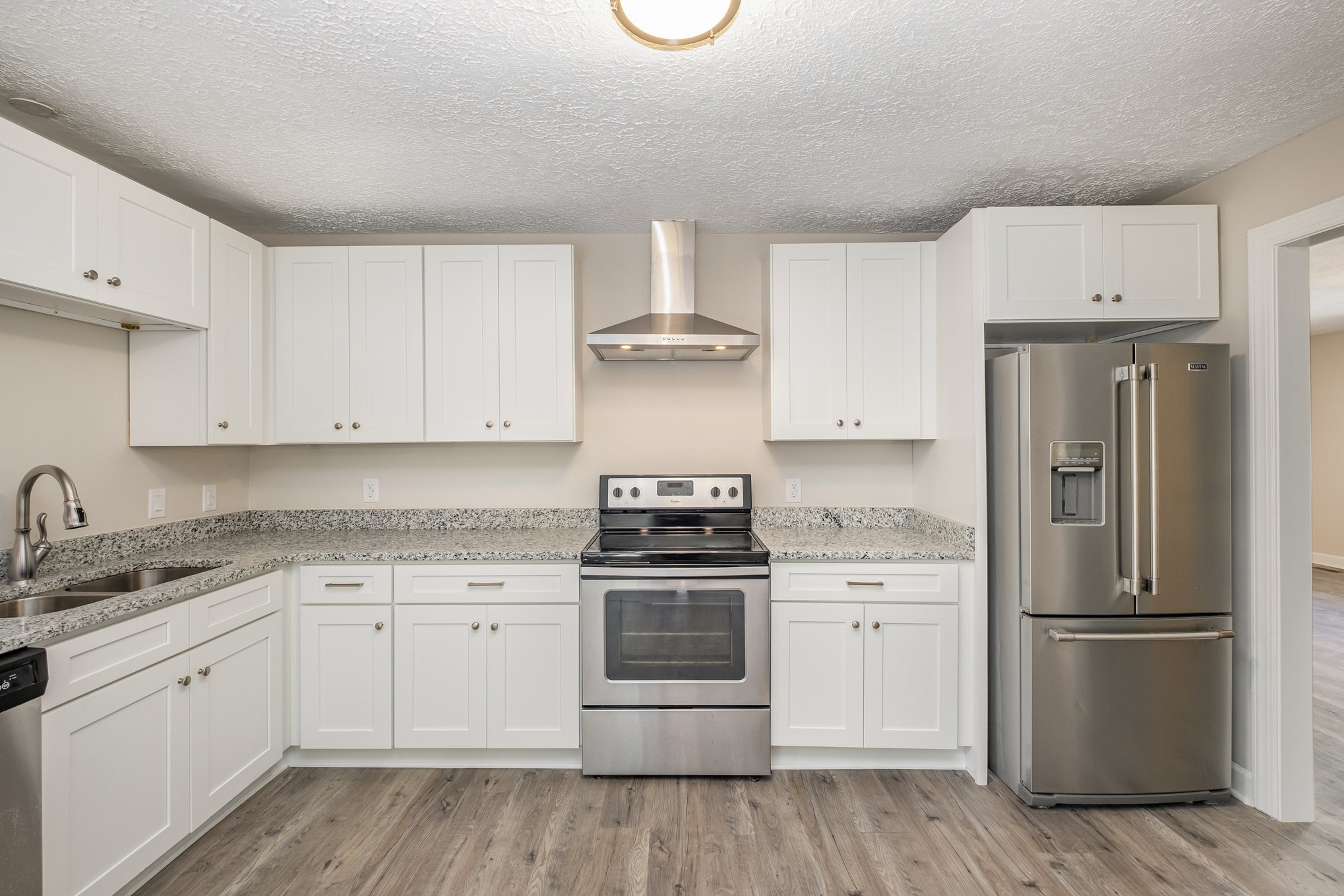 417 West Coffee Street Tullahoma, TN 37388 - Photo 8 of 34 a kitchen with a stove top oven and refrigerator