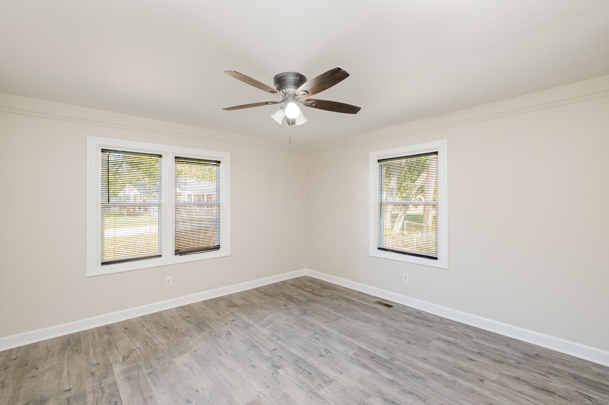 417 West Coffee Street Tullahoma, TN 37388 - Photo 10 of 34 a view of an empty room with a window and a chandelier fan