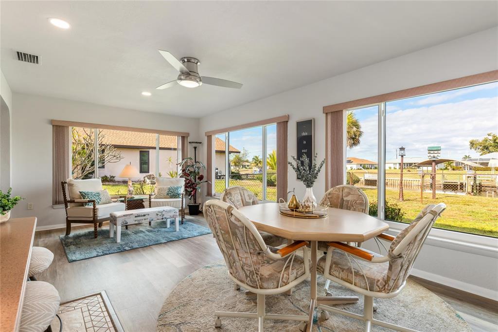 774 Spring Lake Boulevard Northwest Port Charlotte, FL 33952 - Photo 12 of 29 a view of a dining room with furniture window and outside view