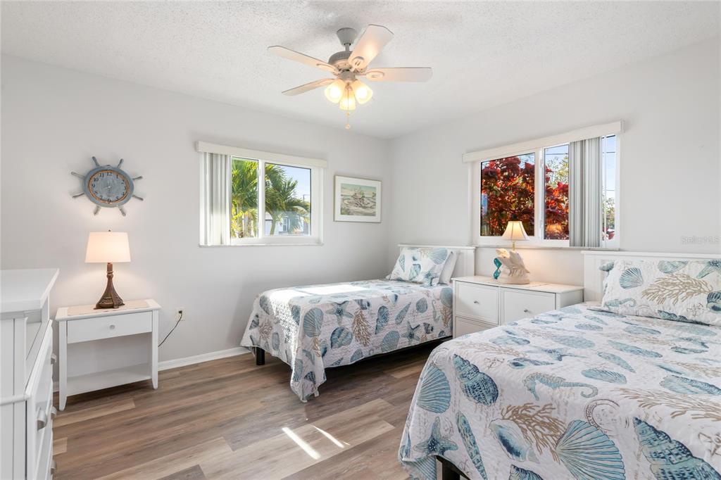 774 Spring Lake Boulevard Northwest Port Charlotte, FL 33952 - Photo 16 of 29 a bedroom with two beds and a window