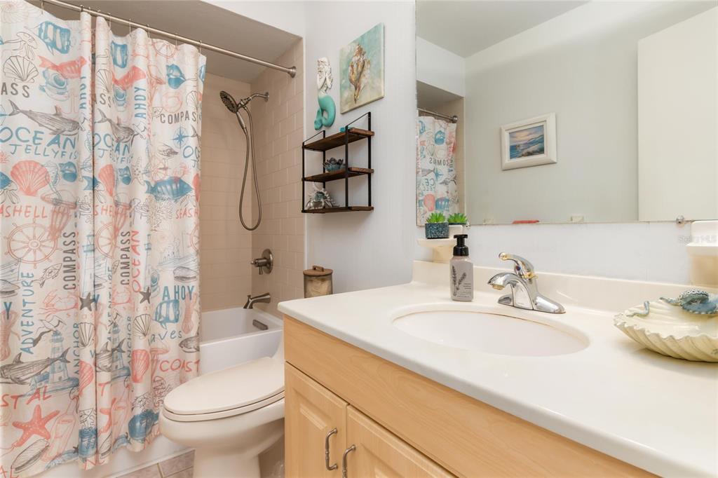 774 Spring Lake Boulevard Northwest Port Charlotte, FL 33952 - Photo 17 of 29 a bathroom with a sink toilet and shower